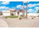 Charming single-story home with manicured desert landscaping, solar panels and a red tile roof at 7503 W Julie Dr, Glendale, AZ 85308