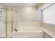 Bright bathroom with a separate shower and soaking tub, offering a spa-like experience at 7503 W Julie Dr, Glendale, AZ 85308