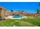 Spacious backyard with a pool and spa, and a grassy area perfect for outdoor activities at 7722 W Libby St, Glendale, AZ 85308