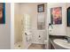 Bathroom featuring a walk-in shower with glass blocks at 7722 W Libby St, Glendale, AZ 85308