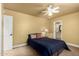 Comfortable bedroom with neutral walls and carpet, plus a bed and adjoining bathroom access at 7722 W Libby St, Glendale, AZ 85308