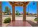 Inviting front porch with a well-lit entryway and well-maintained landscaping at 7722 W Libby St, Glendale, AZ 85308