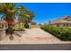 Well-maintained home with mature landscaping, long driveway, and desert landscaping for low maintenance at 7722 W Libby St, Glendale, AZ 85308