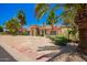 Well-maintained home with mature landscaping, long driveway, and desert landscaping for low maintenance at 7722 W Libby St, Glendale, AZ 85308