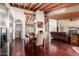 Bright open living space with wood beam ceilings and multiple spaces for entertaining at 7722 W Libby St, Glendale, AZ 85308