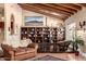 Living room features vaulted ceilings, built in shelves, hardwood floors, and lots of natural light at 7722 W Libby St, Glendale, AZ 85308
