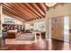 Living room features vaulted ceilings, beautiful hardwood floors, large windows, and lots of natural light at 7722 W Libby St, Glendale, AZ 85308