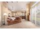 Spacious living room with high ceilings, carpet flooring, and a cozy seating area at 7722 W Libby St, Glendale, AZ 85308