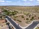 A desert community featuring tile-roofed homes near a community park with walking paths and desert vegetation at 10749 W Lariat Ln, Peoria, AZ 85383