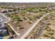 Scenic aerial view of homes near a park with walking paths and desert landscaping at 10749 W Lariat Ln, Peoria, AZ 85383