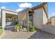 Cozy backyard with an outdoor living area with comfortable seating and a shade canopy at 10749 W Lariat Ln, Peoria, AZ 85383