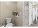 Convenient half-bathroom with toilet, storage, and easy access to adjacent room at 10749 W Lariat Ln, Peoria, AZ 85383