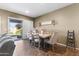 Bright dining room with sliding door, stylish furniture, and decorative accents at 10749 W Lariat Ln, Peoria, AZ 85383
