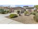 Lovely single-Gathering home with desert landscaping, an American flag, and a two-car garage at 10749 W Lariat Ln, Peoria, AZ 85383