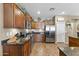 Spacious kitchen features stainless steel appliances, ample cabinetry, and granite countertops at 10749 W Lariat Ln, Peoria, AZ 85383