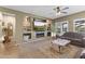 Cozy living room with a fireplace, built-in shelving, and comfortable seating at 10749 W Lariat Ln, Peoria, AZ 85383