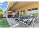 Expansive covered patio with comfortable seating, ideal for enjoying outdoor living and entertaining at 10749 W Lariat Ln, Peoria, AZ 85383