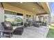 Large, covered patio featuring ample seating, perfect for outdoor gatherings and relaxation at 10749 W Lariat Ln, Peoria, AZ 85383