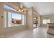 Bright dining area featuring tile floors, backyard access, and large windows offering plenty of natural light at 10936 N Ventana W Dr, Peoria, AZ 85373