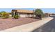 Well-maintained home exterior featuring desert landscaping, a decorative fence, and a tile roof at 10936 N Ventana W Dr, Peoria, AZ 85373
