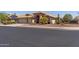 Attractive home with three-car garage, desert landscaping, and a tile roof under a clear blue sky at 10936 N Ventana W Dr, Peoria, AZ 85373