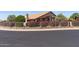 Charming home exterior featuring desert landscaping, a decorative fence, and manicured bougainvillea bushes at 10936 N Ventana W Dr, Peoria, AZ 85373