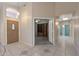 Welcoming foyer with tile flooring and views into the home's multiple rooms at 10936 N Ventana W Dr, Peoria, AZ 85373