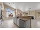 Open kitchen features tile floors, plenty of natural light, stone countertops, and stainless steel appliances at 10936 N Ventana W Dr, Peoria, AZ 85373