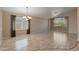 Bright living room featuring wood-look floors, recessed lighting, and large windows at 10936 N Ventana W Dr, Peoria, AZ 85373
