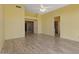 Bright main bedroom boasts a ceiling fan and a doorway leading to an adjacent area at 10936 N Ventana W Dr, Peoria, AZ 85373