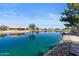Scenic waterfront community featuring tranquil water views and lush landscaping, enhancing the serene atmosphere at 10936 N Ventana W Dr, Peoria, AZ 85373