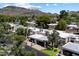 Aerial view showcasing the neighborhood's layout, landscaping, and community features with mountain views at 1120 E Beryl Ave, Phoenix, AZ 85020