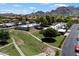 Scenic aerial view of Scottsdale community featuring lush green spaces and mountain views at 1120 E Beryl Ave, Phoenix, AZ 85020