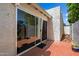 Private backyard patio with brick and sliding glass door access for peaceful outdoor relaxation at 1120 E Beryl Ave, Phoenix, AZ 85020