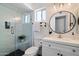 Bathroom with glass shower and black and white accents, offering a spa-like retreat for relaxation at 1120 E Beryl Ave, Phoenix, AZ 85020