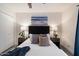 Relaxing bedroom with neutral decor, a ceiling fan, and ample closet space, offering comfort and functionality at 1120 E Beryl Ave, Phoenix, AZ 85020