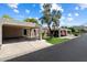 Wide angle view of a single story home showing the dual carports and landscaping at 1120 E Beryl Ave, Phoenix, AZ 85020
