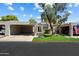 Charming home featuring dual carports, manicured lawn, and decorative stucco exterior at 1120 E Beryl Ave, Phoenix, AZ 85020