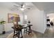 Office space features bright lighting, neutral tones, and a ceiling fan with a view to the outdoors at 1120 E Beryl Ave, Phoenix, AZ 85020