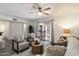 Comfortable living room with outdoor access, contemporary decor and updated ceiling fan at 1120 E Beryl Ave, Phoenix, AZ 85020
