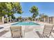 Sparkling community pool with lounge chairs and shaded seating area at 1120 E Beryl Ave, Phoenix, AZ 85020