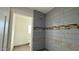 Bathroom featuring tiled shower with upgraded shower head and accent tiles at 121 E Monte Way, Phoenix, AZ 85042