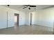 Bright bedroom with a ceiling fan, offering a serene and adaptable space for comfort and relaxation at 121 E Monte Way, Phoenix, AZ 85042