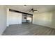 Bright and airy living room featuring gray wood-look flooring and plenty of space at 121 E Monte Way, Phoenix, AZ 85042