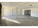 An expansive living room, featuring stone fireplace, bathed in natural light with versatile design potential at 121 E Monte Way, Phoenix, AZ 85042