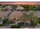 Aerial view of a private backyard featuring an outdoor living space, pool and lush tropical landscaping at 1410 S Los Altos Dr, Chandler, AZ 85286