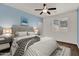 Comfortable primary bedroom features a large bed with a padded headboard, and a ceiling fan at 1410 S Los Altos Dr, Chandler, AZ 85286