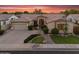Inviting single-Gathering home with beautiful landscaping, stone accents, mature trees, and a winding walkway at 1410 S Los Altos Dr, Chandler, AZ 85286