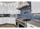 Modern kitchen featuring a stainless steel range hood and high-end stainless steel appliances at 1410 S Los Altos Dr, Chandler, AZ 85286