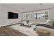 Comfortable living room features a large sectional sofa, media center, and a bright, airy atmosphere at 1410 S Los Altos Dr, Chandler, AZ 85286